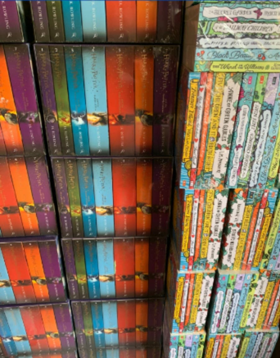 Shelves of classic children's books given to Book Club students